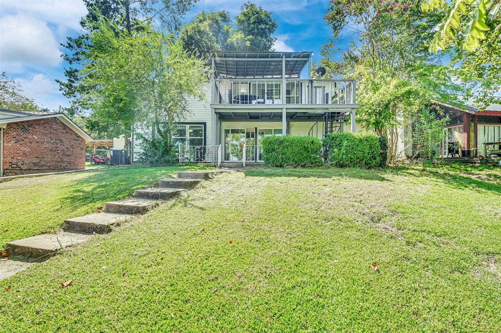 10525 Post Oak Bend Lane Wills Point, TX 75169 - Photo 38 of 40 Rear view of house with a yard