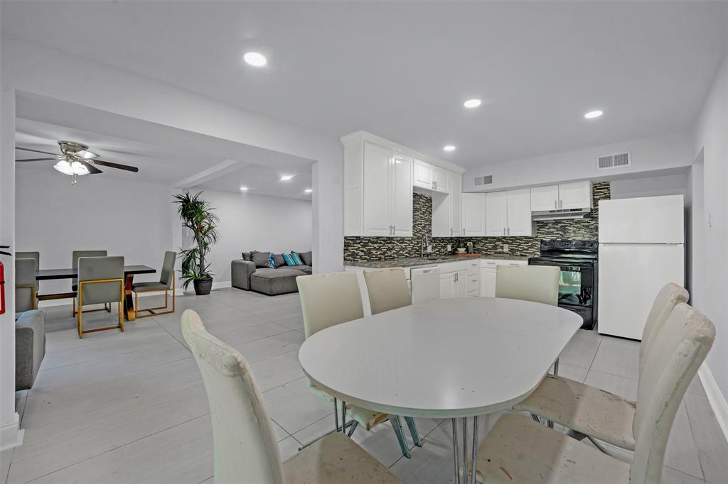 10525 Post Oak Bend Lane Wills Point, TX 75169 - Photo 7 of 40 Dining room with recessed lighting, ceiling fan, light tile patterned flooring, and beamed ceiling