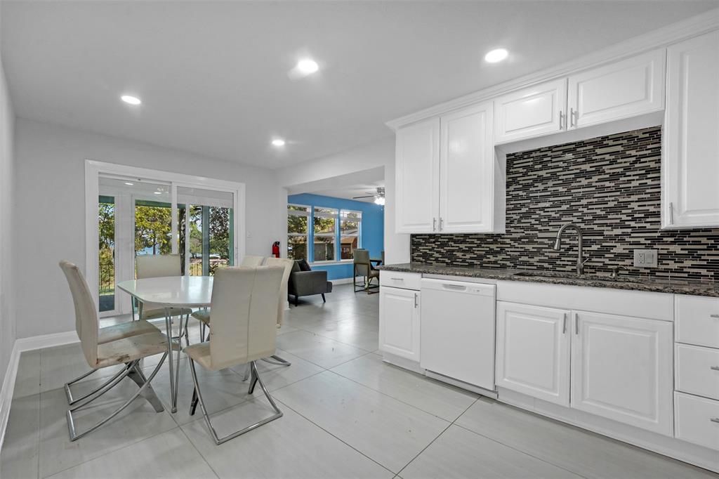 10525 Post Oak Bend Lane Wills Point, TX 75169 - Photo 9 of 40 Kitchen with dark stone counters, white cabinetry, white dishwasher, decorative backsplash, and recessed lighting