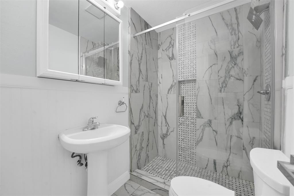 10525 Post Oak Bend Lane Wills Point, TX 75169 - Photo 10 of 40 Full bath featuring a marble finish shower and marble look tile flooring