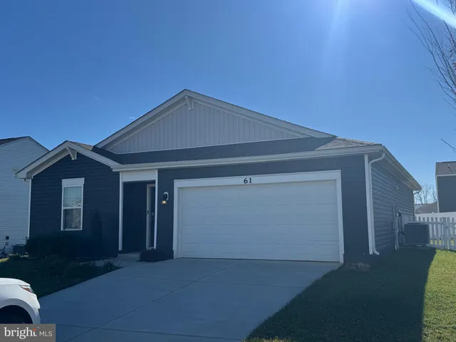 a front view of a house with yard