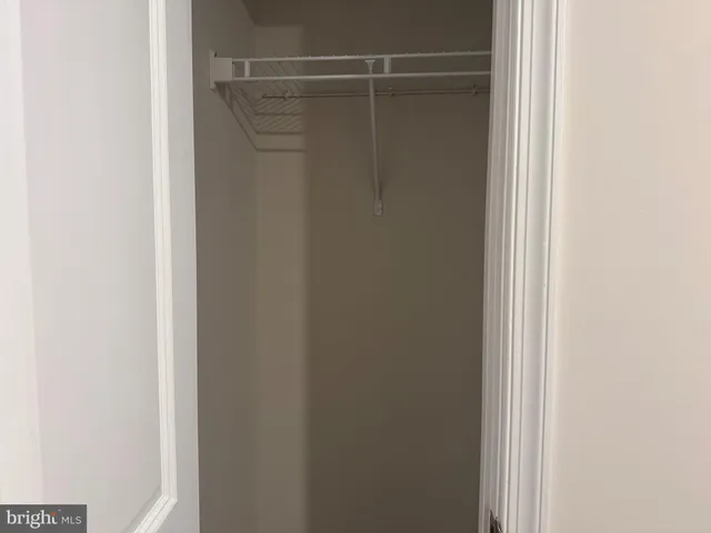 a view of an empty room and closet