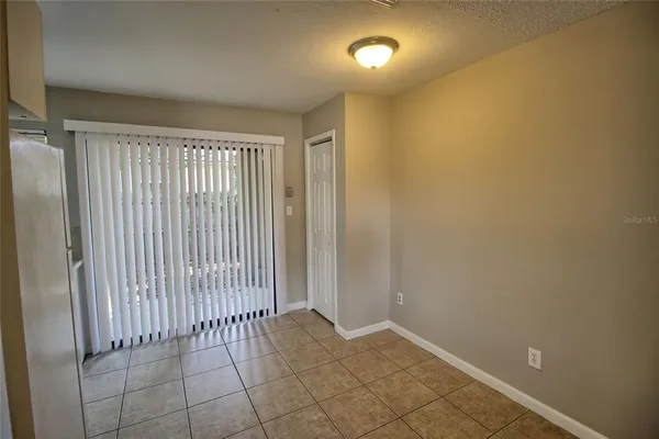 an empty room with sliding door