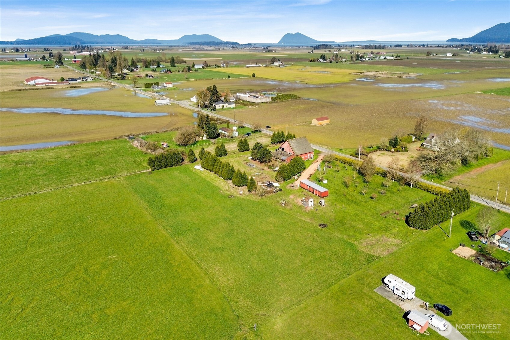 a view of an ocean and a mountain