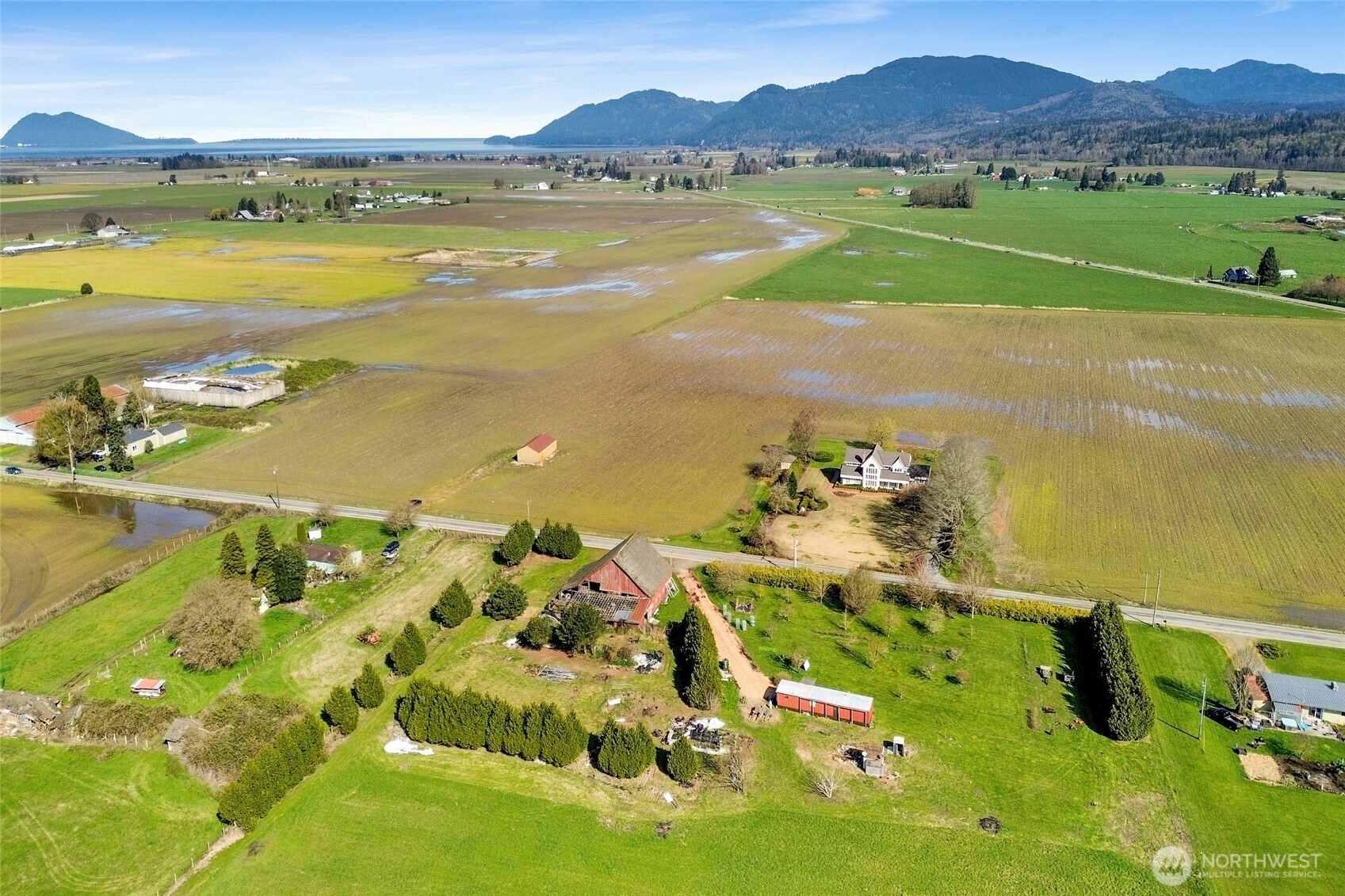 16068 Field Road Bow, WA 98232 - Photo 20 of 25 a view of an ocean and a mountain