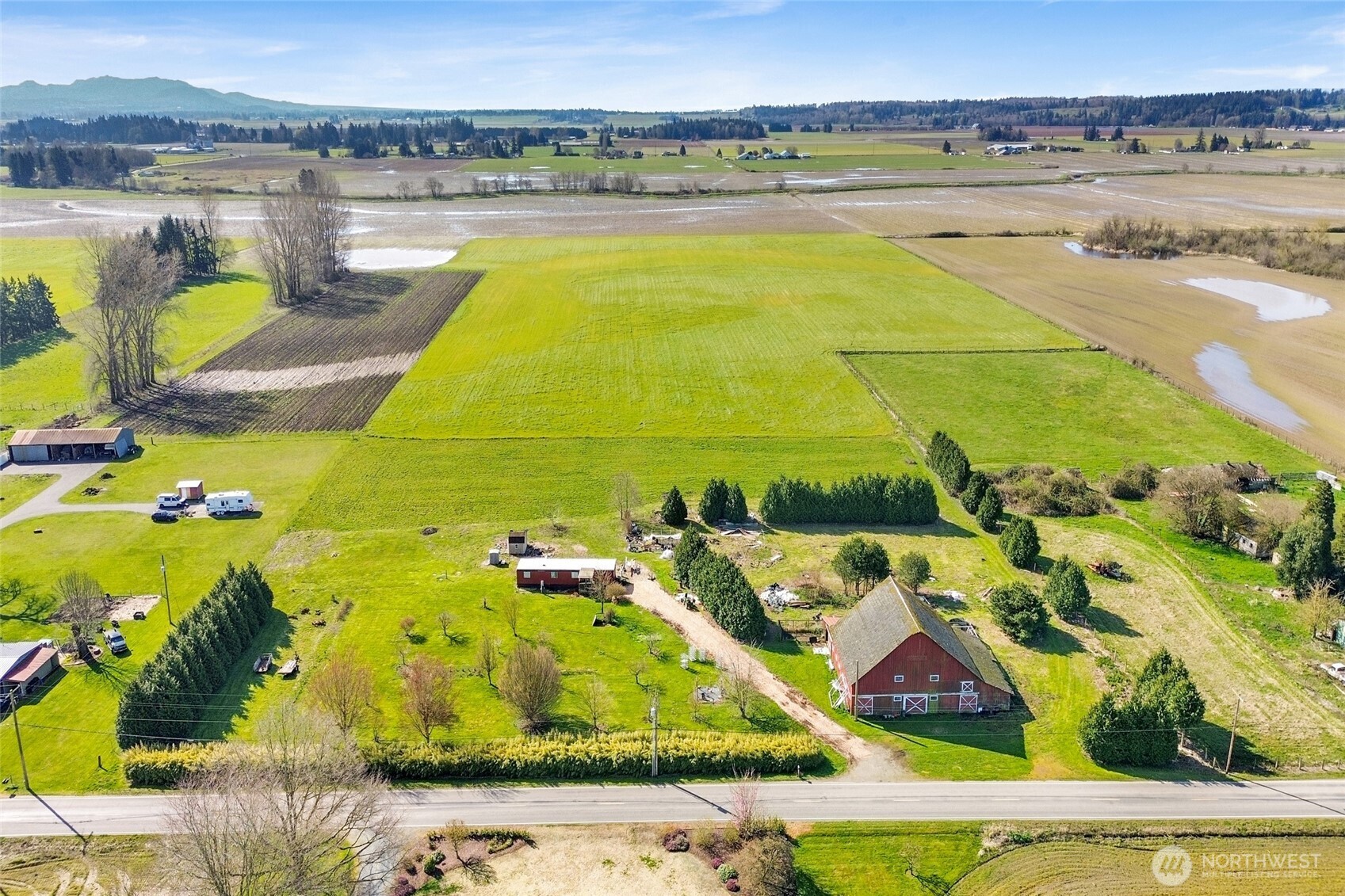 16068 Field Road Bow, WA 98232 - Photo 7 of 25 a view of a swimming pool and an ocean view