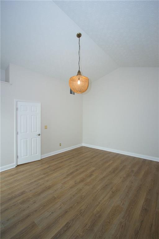 1481 Beckley Pointe Lawrenceville, GA 30043 - Photo 19 of 45 a view of a room with wooden floor and fan