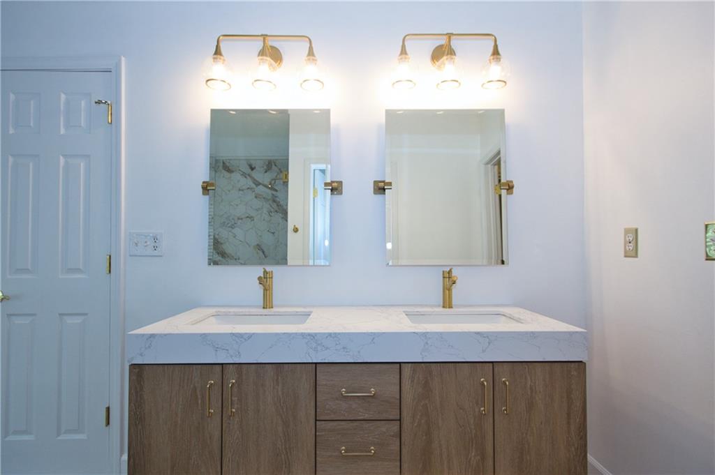 1481 Beckley Pointe Lawrenceville, GA 30043 - Photo 20 of 45 a bathroom with a sink and a mirror