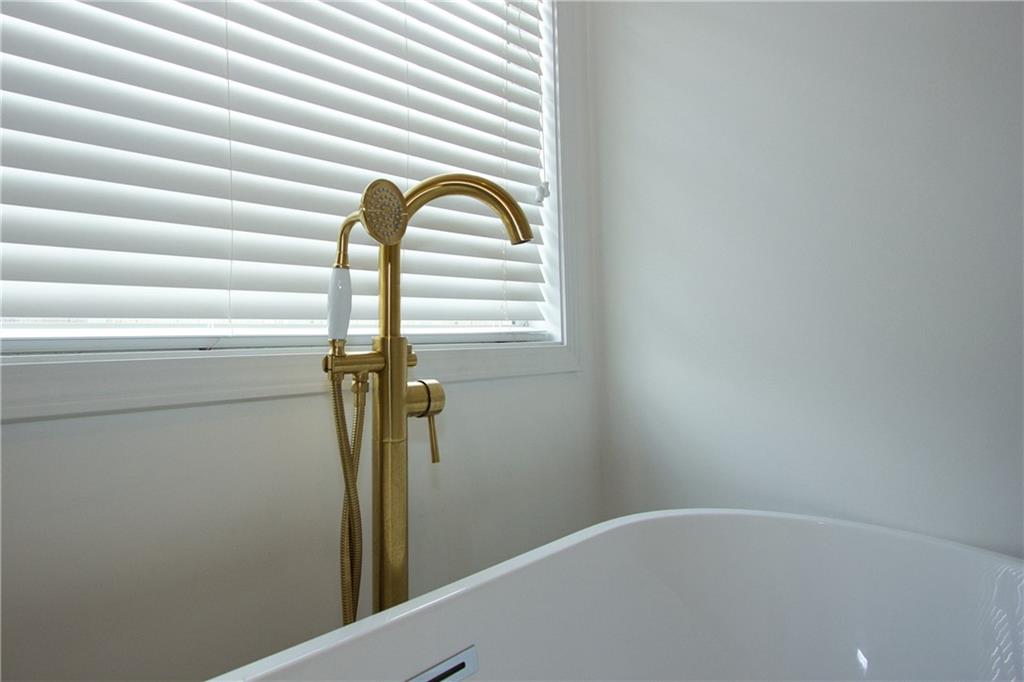 1481 Beckley Pointe Lawrenceville, GA 30043 - Photo 25 of 45 a close view of a bathtub in a bathroom