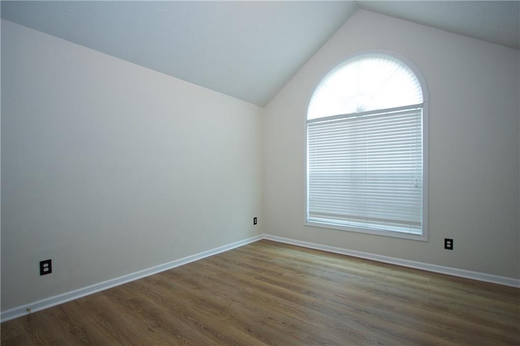 1481 Beckley Pointe Lawrenceville, GA 30043 - Photo 29 of 45 an empty room with wooden floor and windows