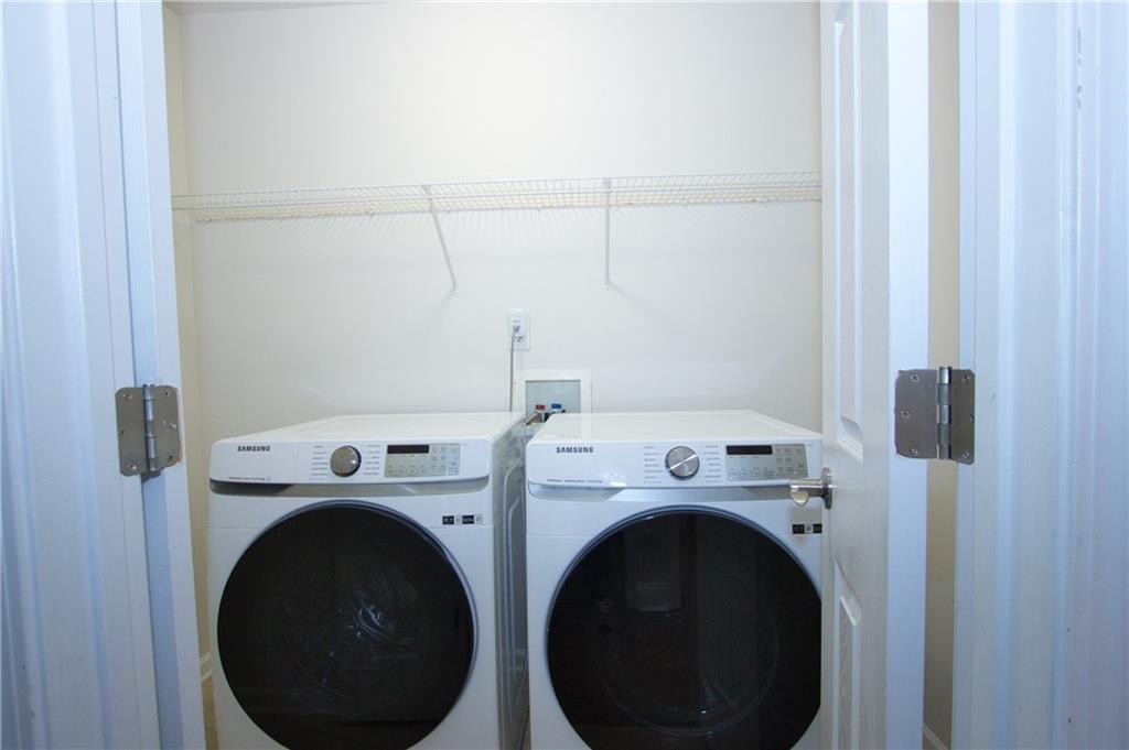 1481 Beckley Pointe Lawrenceville, GA 30043 - Photo 31 of 45 a utility room with dryer and washer