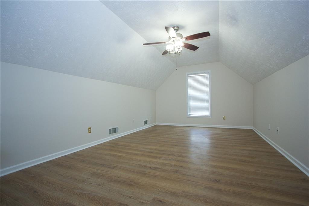 1481 Beckley Pointe Lawrenceville, GA 30043 - Photo 35 of 45 wooden floor in an empty room with a window