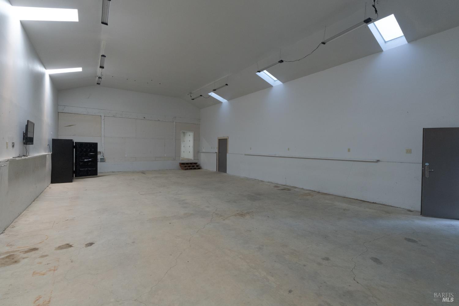 44000 Iversen Road Gualala, CA 95445 - Photo 33 of 57 28 x 50 shop bay with large roll up door, room for rv, boat, or toys