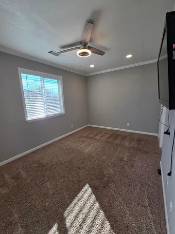 a view of an empty room with a window