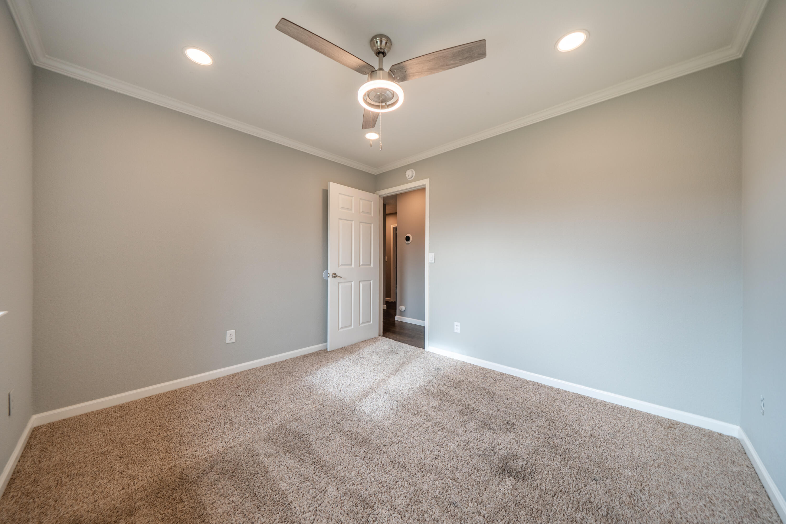 1070 Dara Court Redding, CA 96003 - Photo 18 of 66 an empty room with chandelier fan and ceiling fan