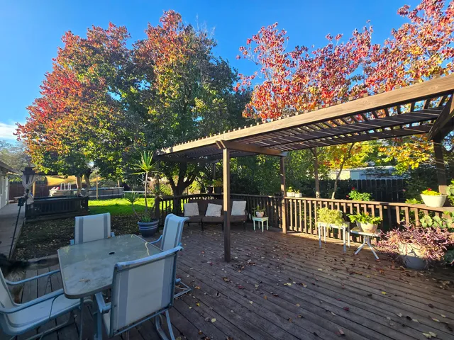 a patio with table and chairs