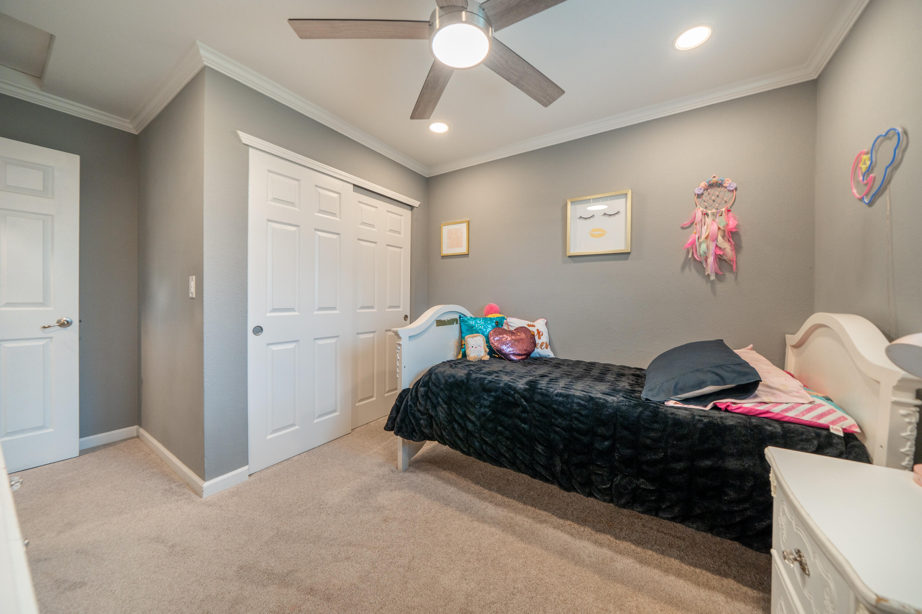 1070 Dara Court Redding, CA 96003 - Photo 25 of 66 a bedroom with a bed and a chandelier