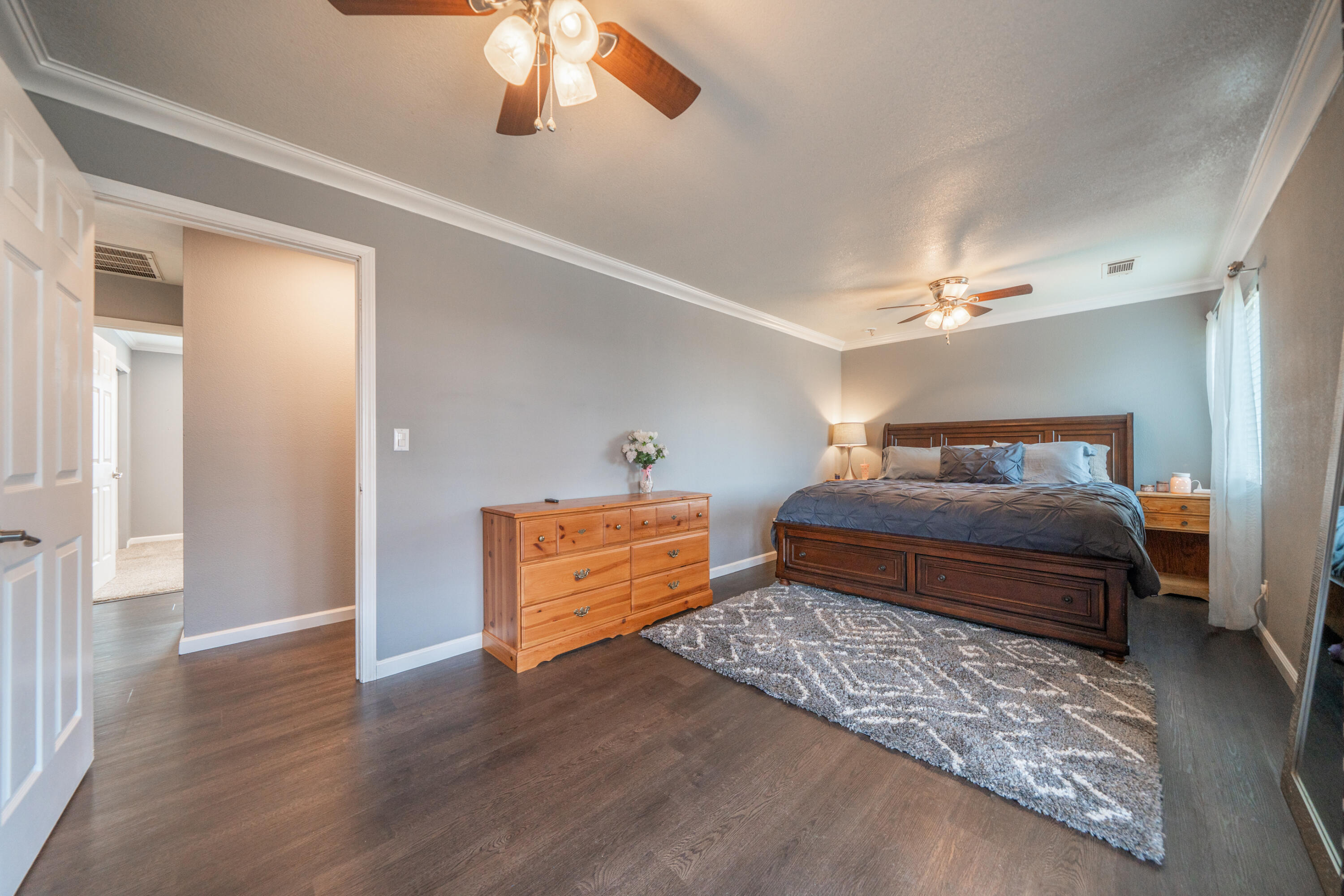 1070 Dara Court Redding, CA 96003 - Photo 28 of 66 a bedroom with a bed and wooden floor
