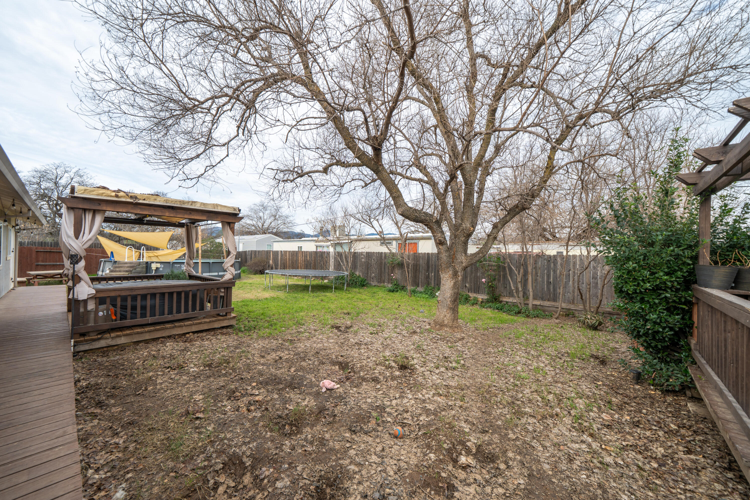 1070 Dara Court Redding, CA 96003 - Photo 37 of 66 a view of outdoor space with garden and trees