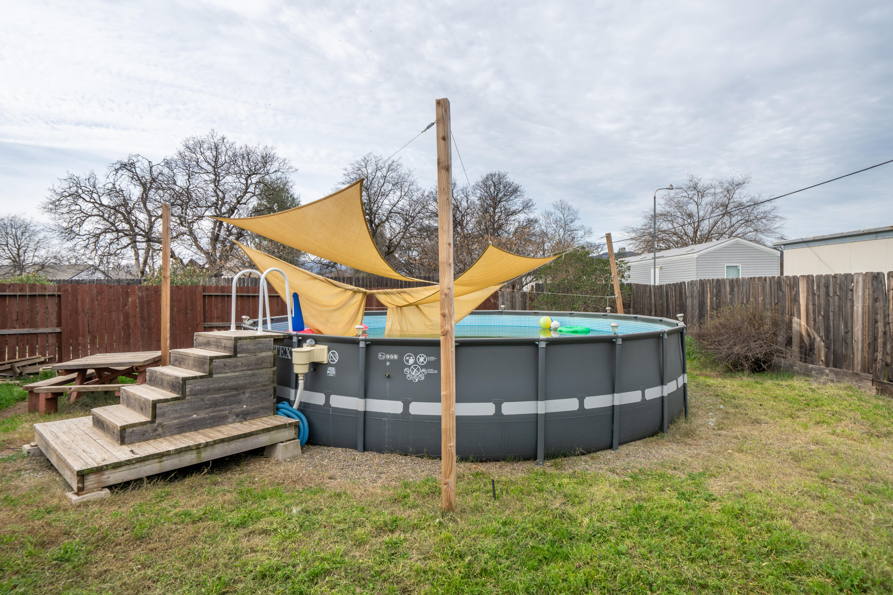 1070 Dara Court Redding, CA 96003 - Photo 42 of 66 a view of a backyard with wooden fence