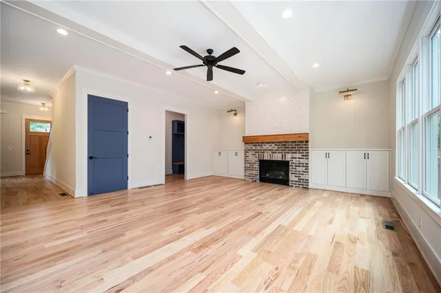 a kitchen with kitchen island a large counter appliances and cabinets