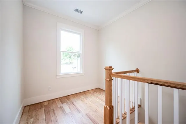 a bathroom with a shower and a glass door