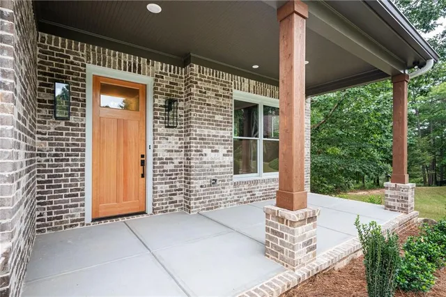 a view of a livingroom with a ceiling fan and window