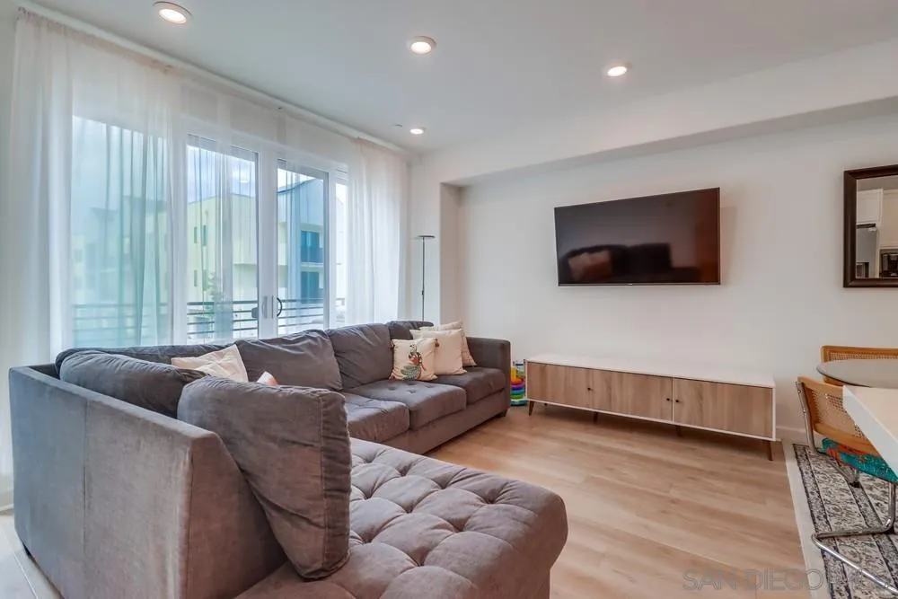 2408 Cascalote Loop San Diego, CA 92154 - Photo 18 of 50 a living room with furniture and a flat screen tv