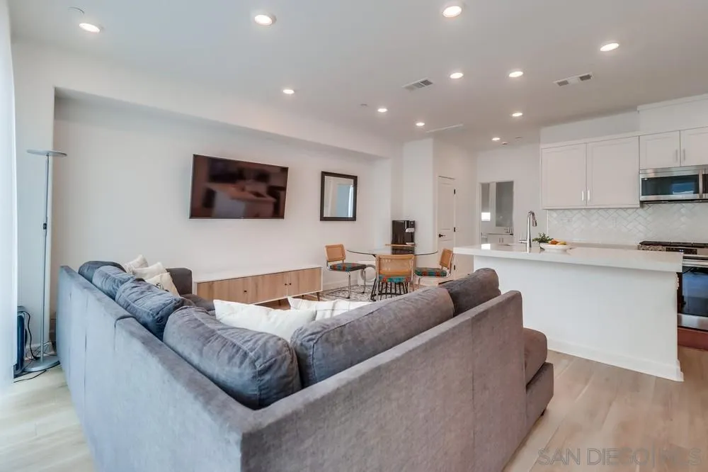 2408 Cascalote Loop San Diego, CA 92154 - Photo 19 of 50 a living room with furniture and a flat screen tv