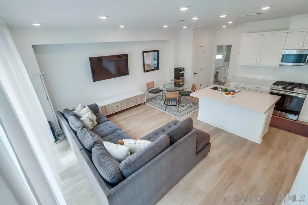 2408 Cascalote Loop San Diego, CA 92154 - Photo 27 of 50 a living room with furniture and a flat screen tv