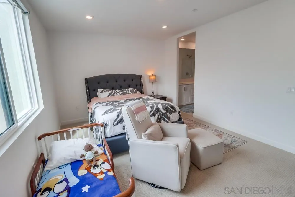 2408 Cascalote Loop San Diego, CA 92154 - Photo 34 of 50 a bedroom with a bed and a window