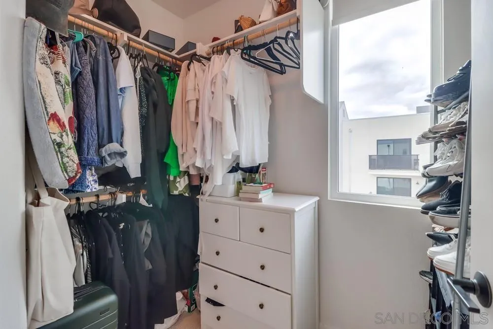 2408 Cascalote Loop San Diego, CA 92154 - Photo 35 of 50 a view of walk in closet with clothes