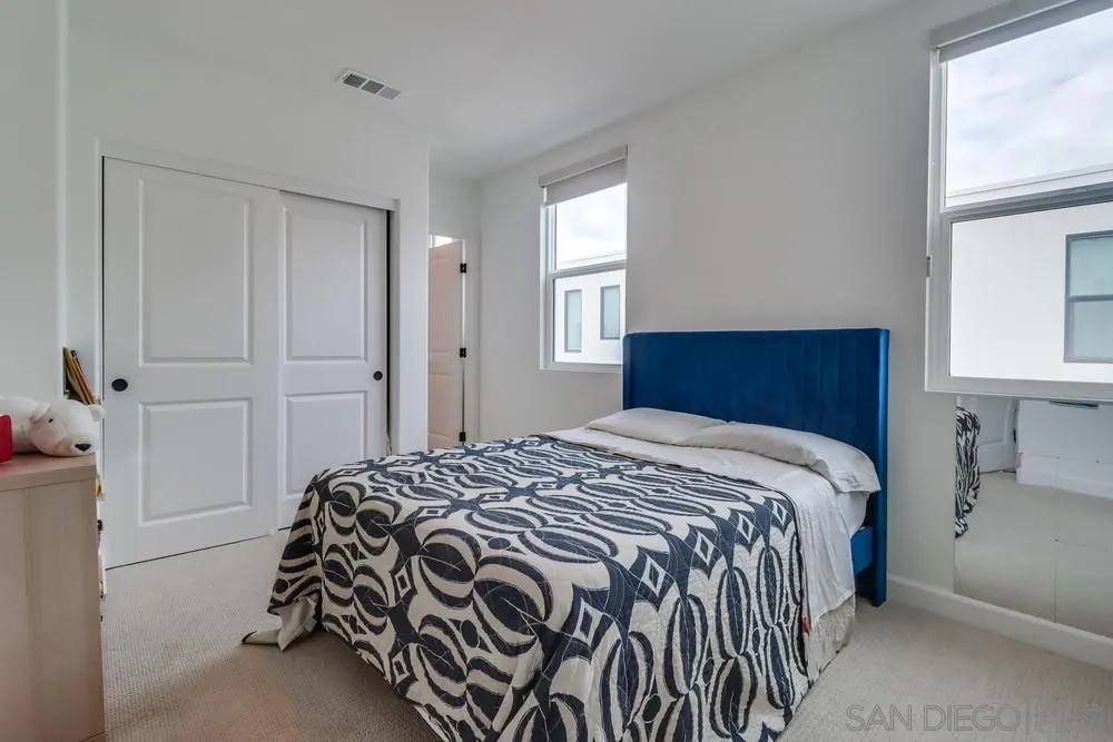 2408 Cascalote Loop San Diego, CA 92154 - Photo 40 of 50 a bedroom with a bed and a window