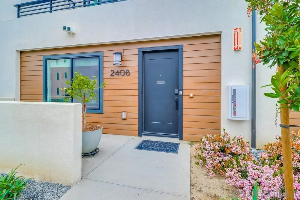 2408 Cascalote Loop San Diego, CA 92154 - Photo 4 of 50 a view of a house with potted plants