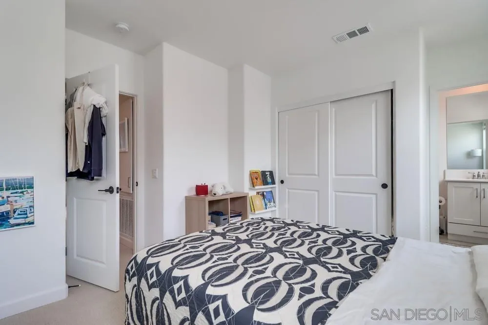 2408 Cascalote Loop San Diego, CA 92154 - Photo 41 of 50 a bedroom with a bed and a closet