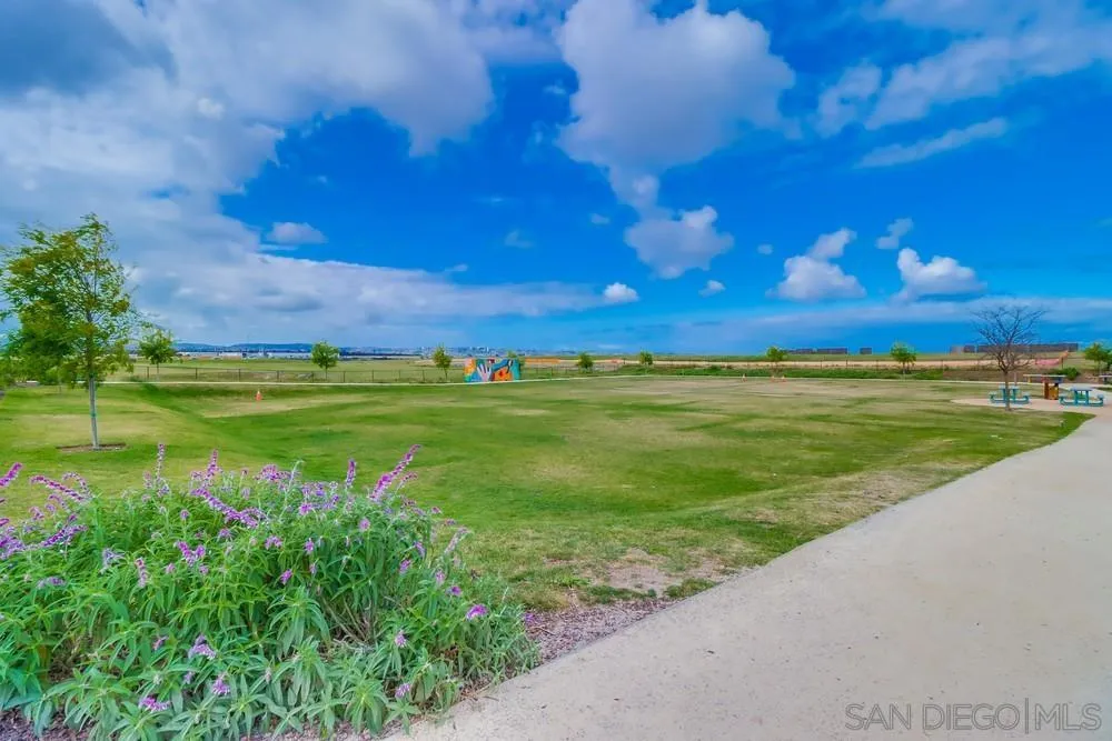 2408 Cascalote Loop San Diego, CA 92154 - Photo 47 of 50 a view of a lake with a big yard
