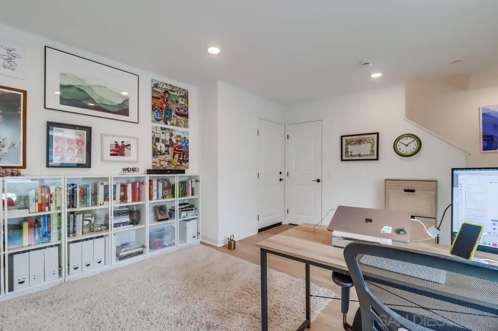2408 Cascalote Loop San Diego, CA 92154 - Photo 7 of 50 a room with furniture and book shelf