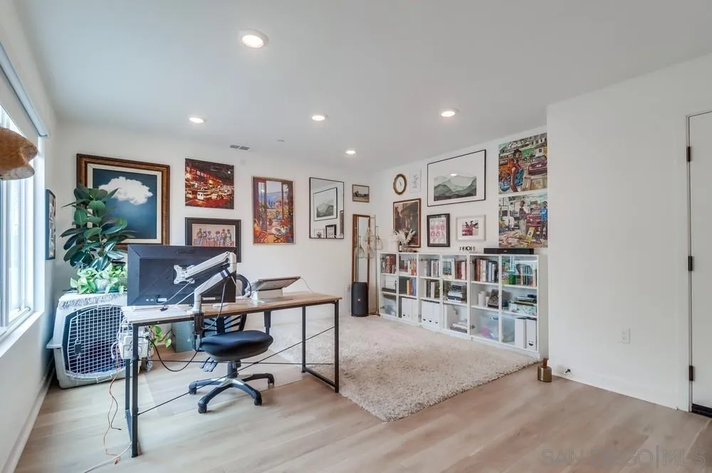 2408 Cascalote Loop San Diego, CA 92154 - Photo 8 of 50 a view of a livingroom with workspace and a couch