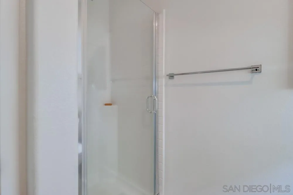 2408 Cascalote Loop San Diego, CA 92154 - Photo 10 of 50 a bathroom with a shower