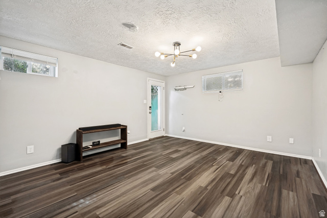 1215 8th Street Ogden, UT 84404 - Photo 30 of 39 Spacious interior featuring wood-finish flooring, light grey walls, and a contemporary ceiling fixture
