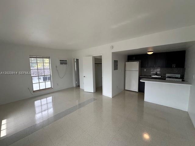 1400 Douglas Road, Unit 17 Coral Gables, FL 33134 - Photo 6 of 16 a view of an empty room and window