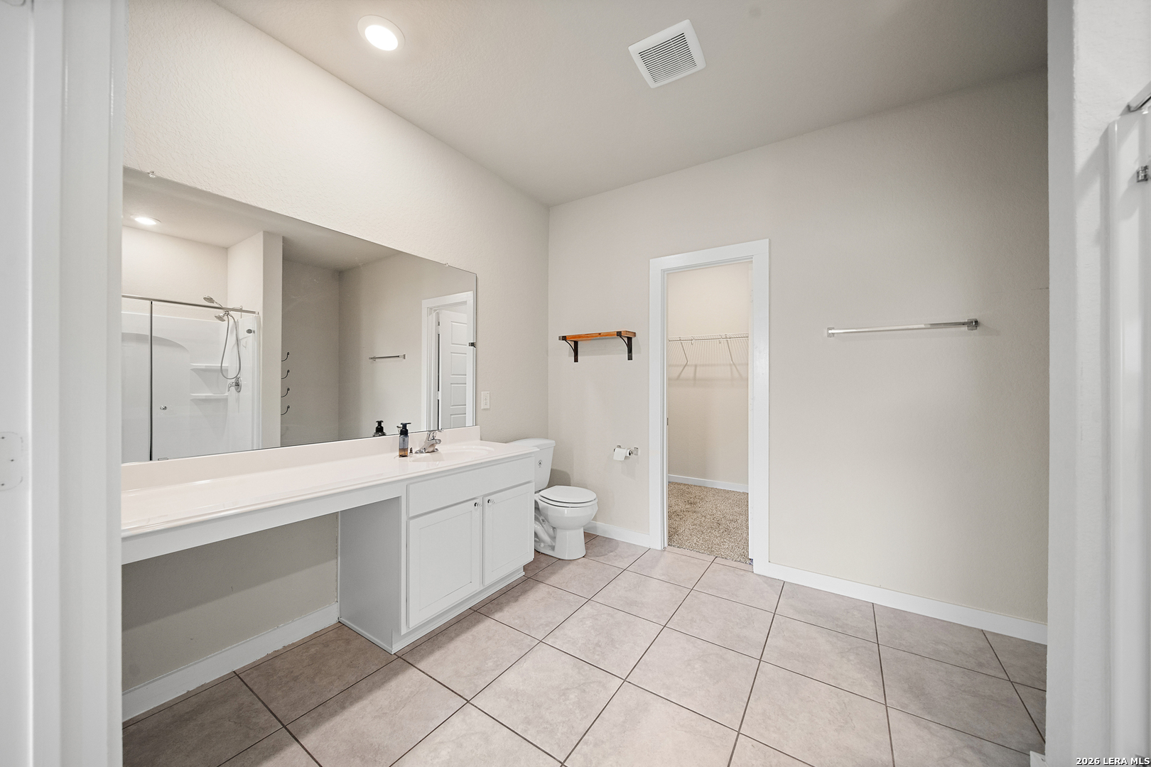 6914 Cetera Way Converse, TX 78109 - Photo 5 of 32 a bathroom with a double vanity sink mirror and toilet