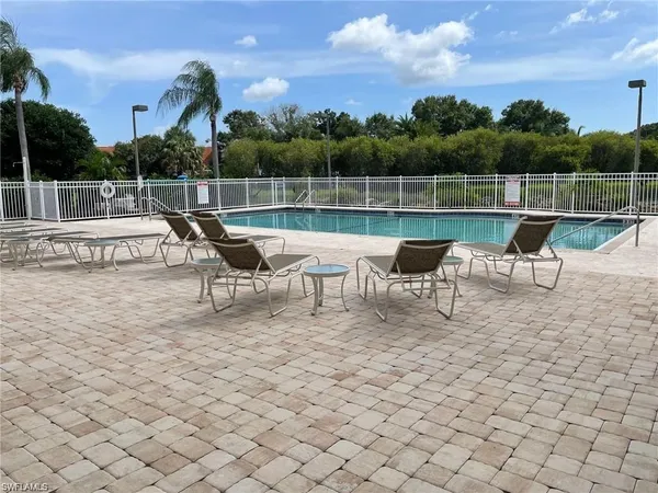 a roof deck with a table and chairs