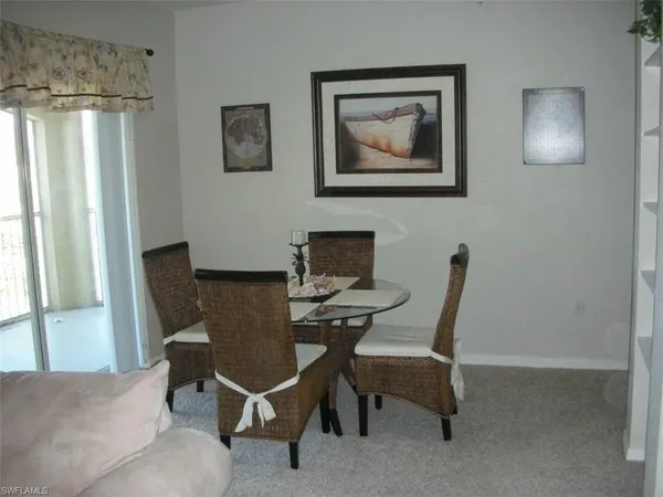 a work room with furniture and a window