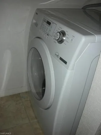 a close view of utility room with washer and dryer