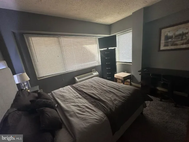 a kitchen with a sink appliances and cabinets