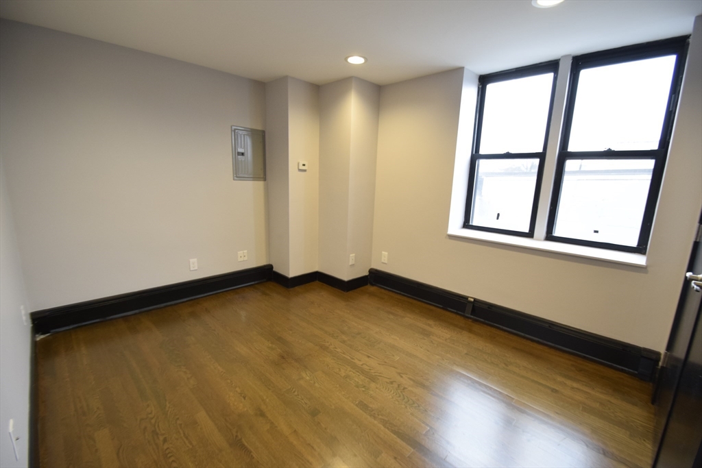 444 Western Avenue, Unit 3 Boston, MA 02135 - Photo 7 of 11 a view of an empty room and window