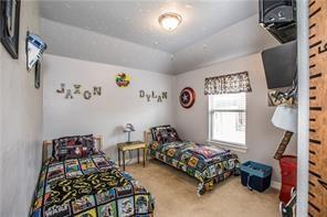 1409 Rosson Road Little Elm, TX 75068 - Photo 14 of 34 Room featuring a vaulted ceiling with a semi-flush mount light fixture, carpet flooring, and a single window with blinds and a valance