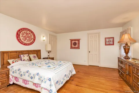 a bedroom with a bed and a table in it