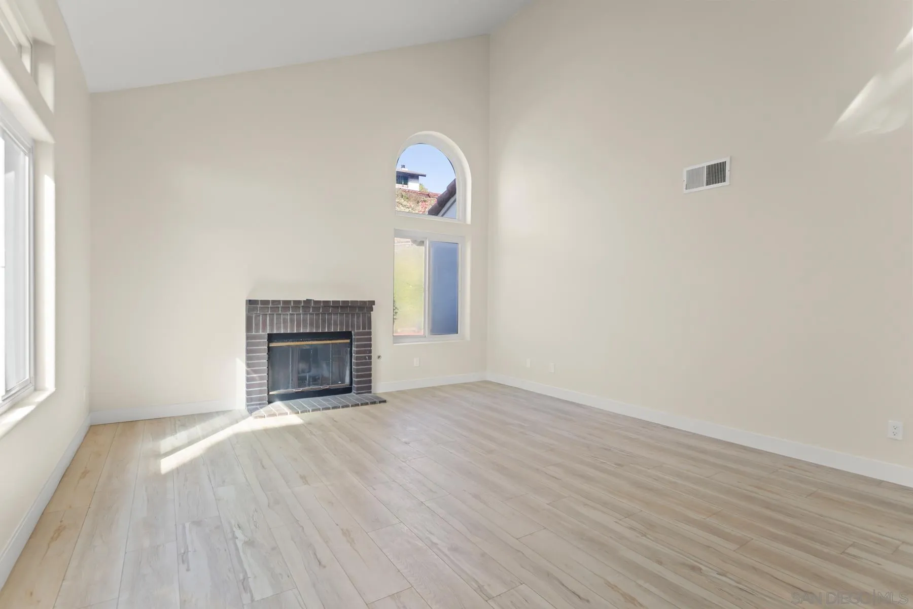 10167 Bluestone Court Spring Valley, CA 91977 - Photo 1 of 49 a view of empty room with wooden floor and fireplace